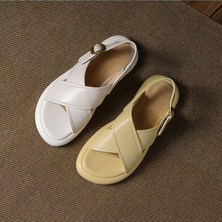 a pair of white and yellow sandals