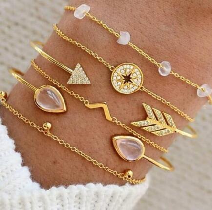 a person wearing gold bracelets
