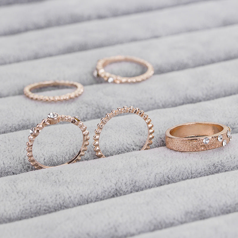 a group of rings on a jewelry display