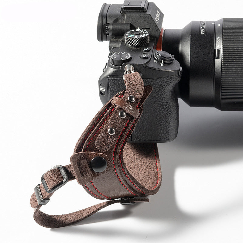 a camera with a leather strap