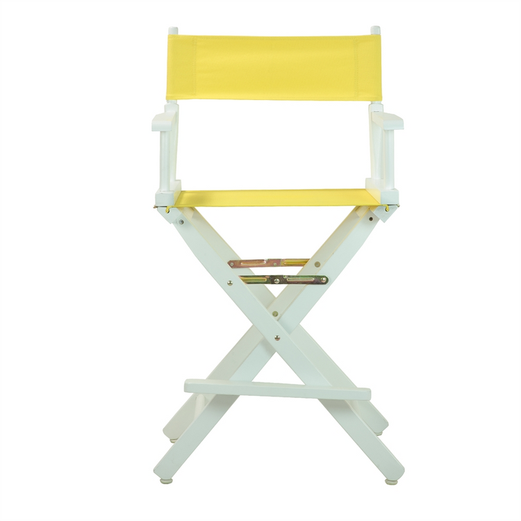 a yellow chair with white legs