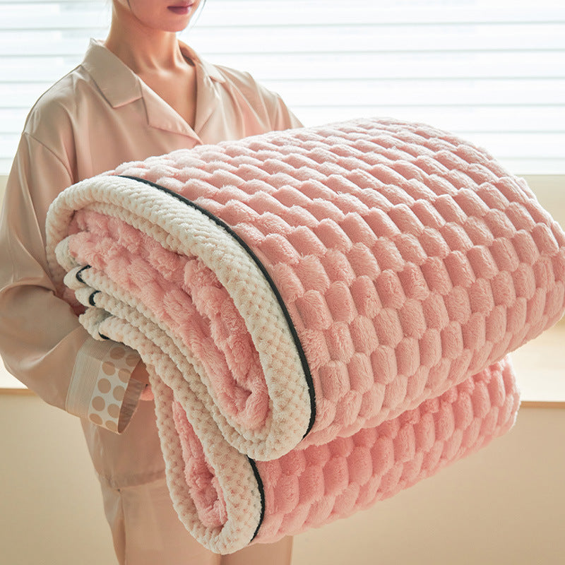 a person holding a pink blanket