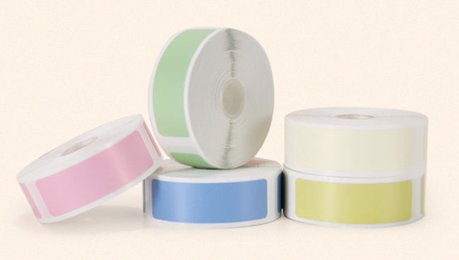 rolls of labels on a white surface