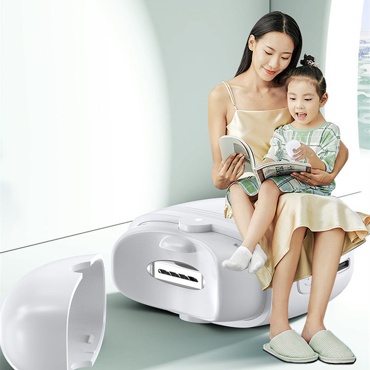 a woman and a child sitting on a suitcase
