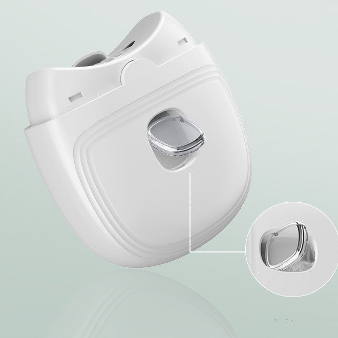 a white device with a button