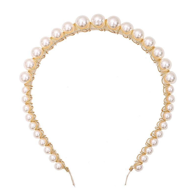 a headband with pearls on it