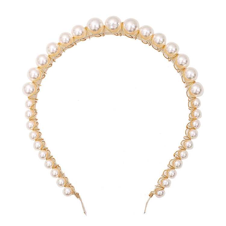 a headband with pearls on it