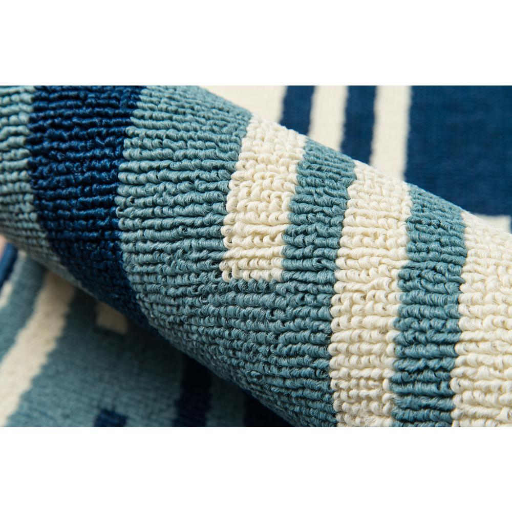 a close up of a blue and white rug