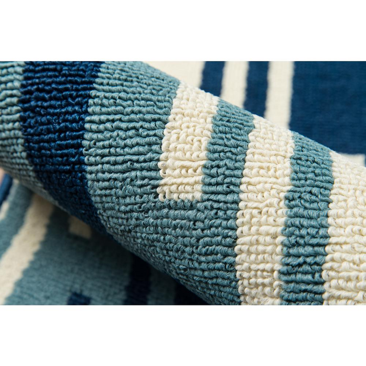 a close up of a blue and white rug