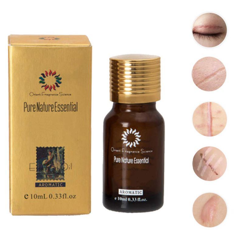 a bottle of essential oil with a box