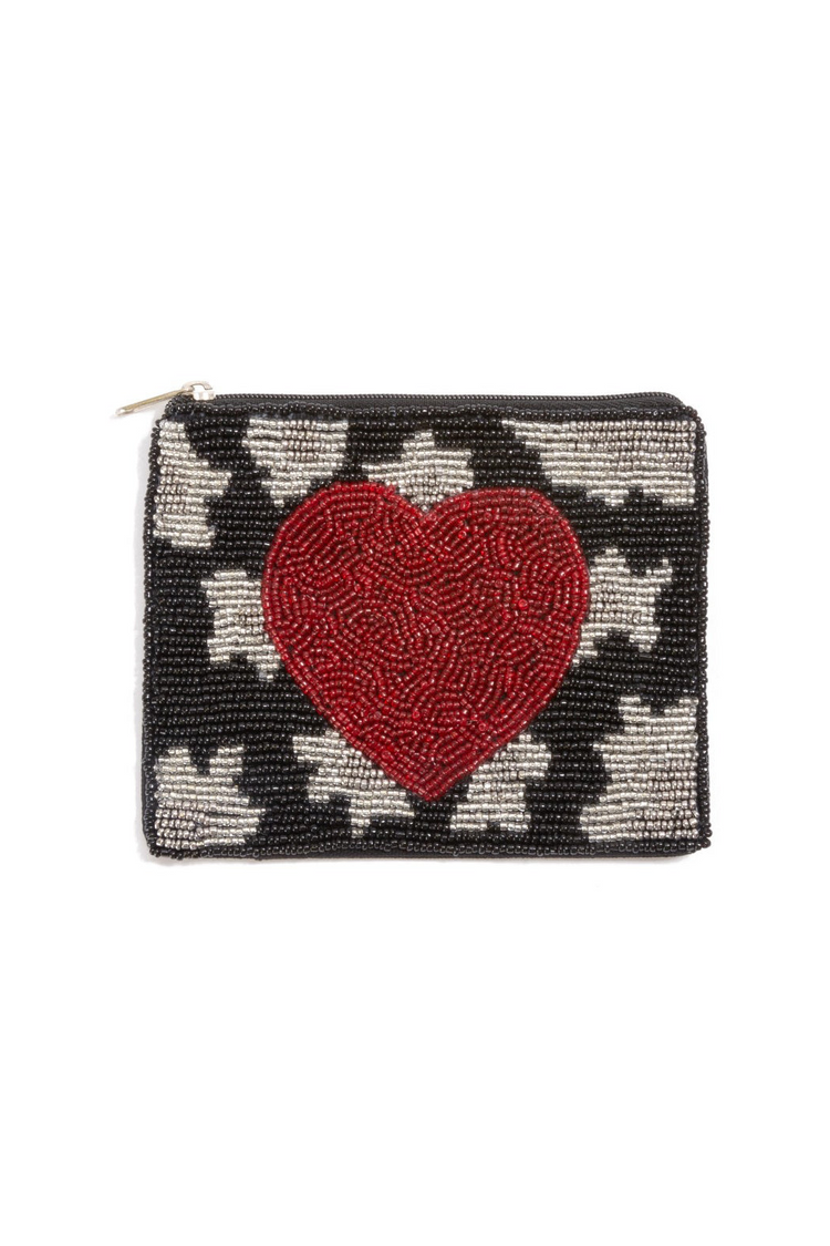 a black and white beaded purse with a red heart