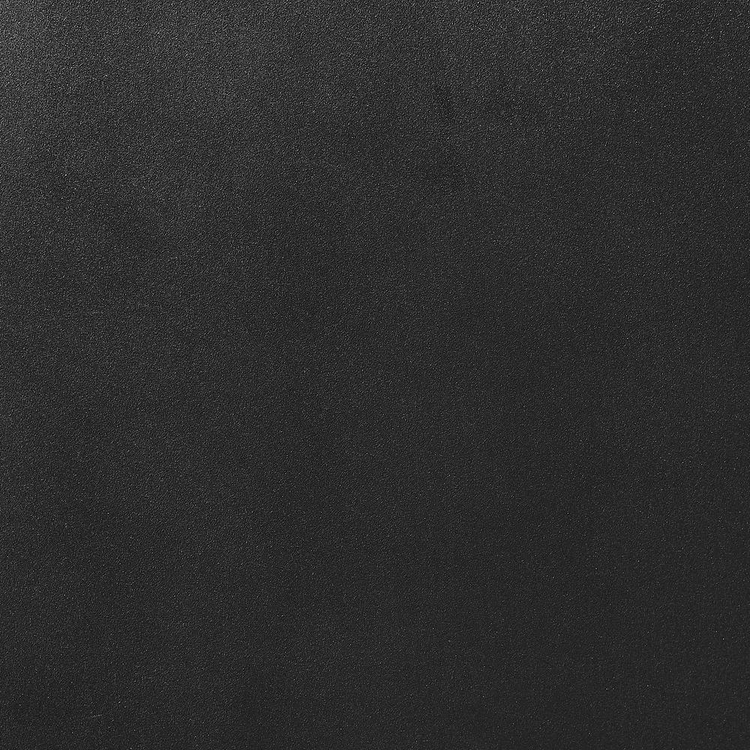 a black surface with small dots