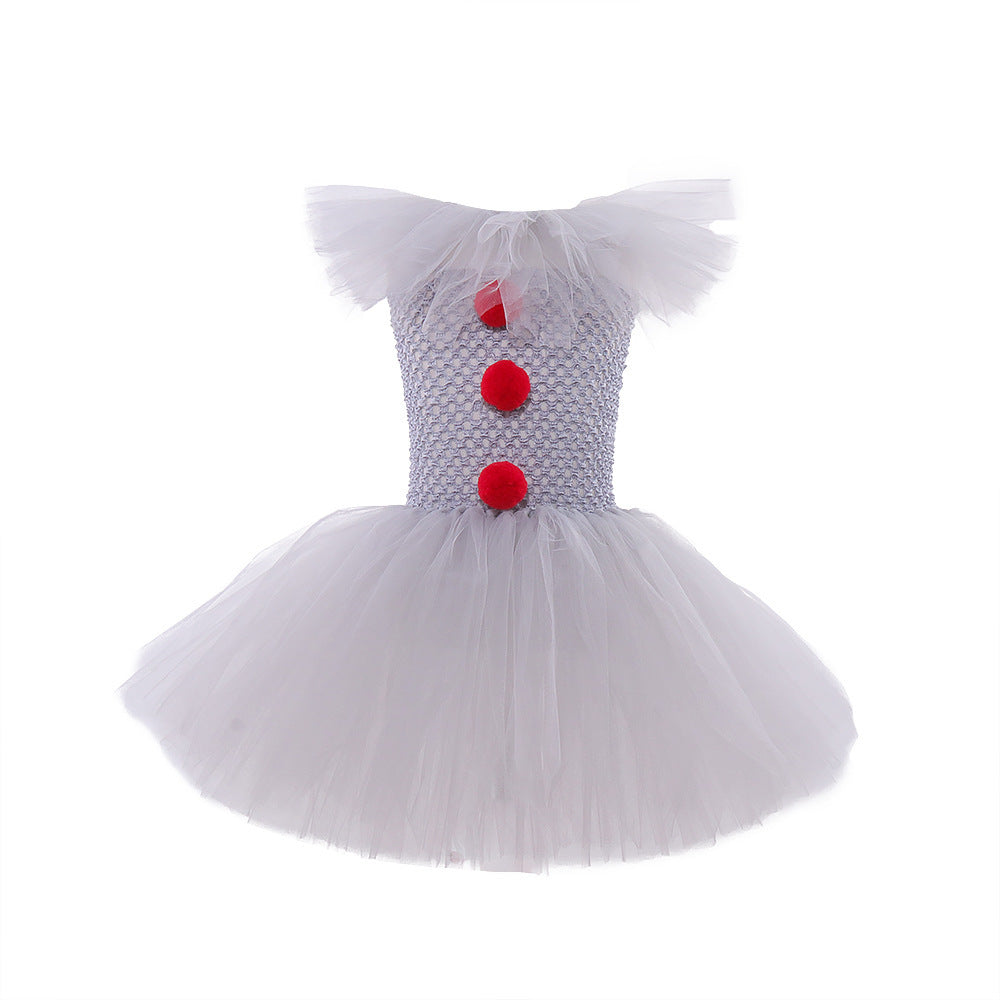 a white tutu with red buttons and a red clown nose