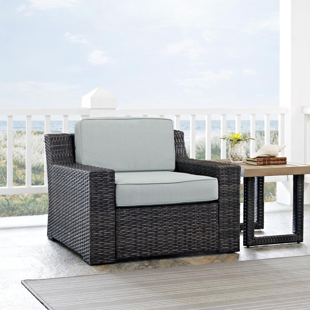 a chair and table on a porch