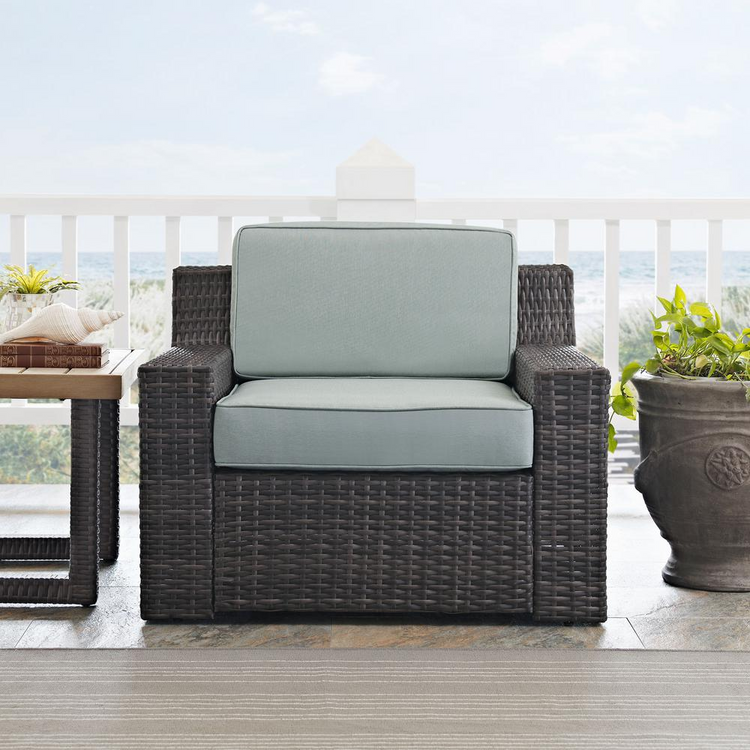 a chair and table on a porch