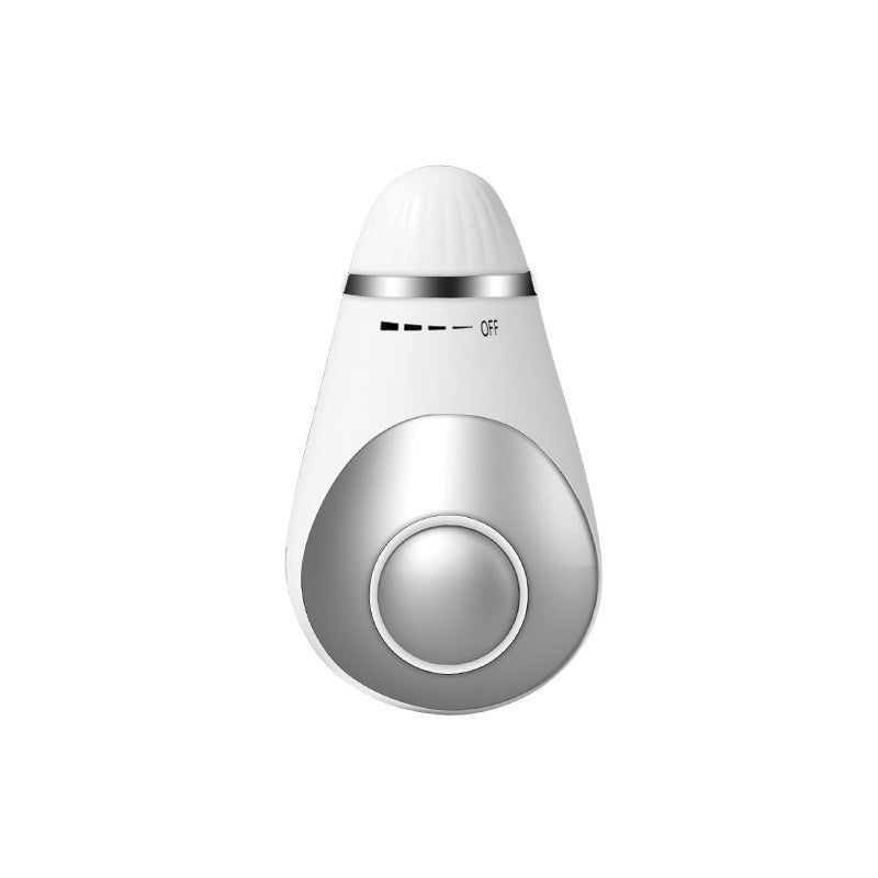 a white and silver object with a button