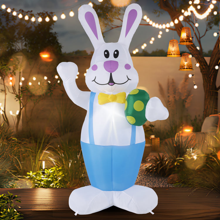 a inflatable bunny holding an egg
