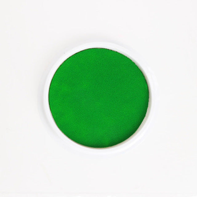 a green powder in a white circle