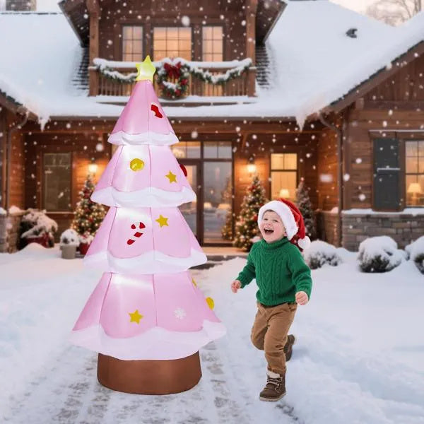 a child running next to a large inflatable christmas tree
