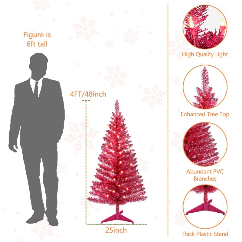 a man standing next to a christmas tree
