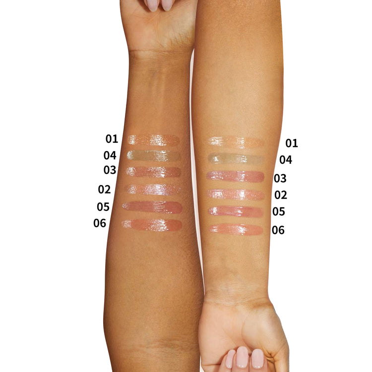 a woman's hands with different shades of makeup on their arms