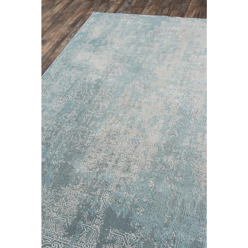 a rug on a wood floor