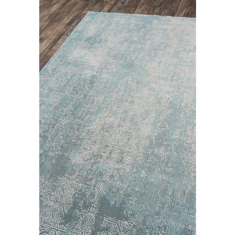 a rug on a wood floor