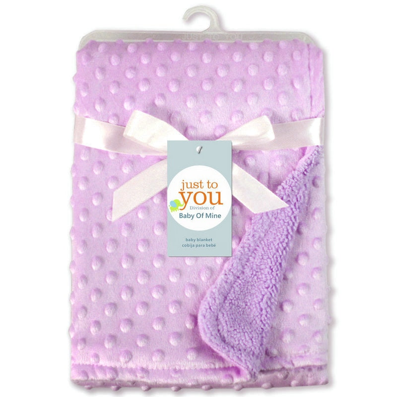 a purple blanket with a bow
