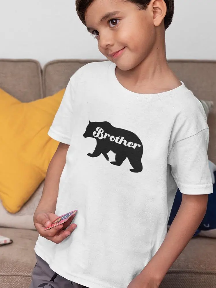 a boy holding a card in his hand