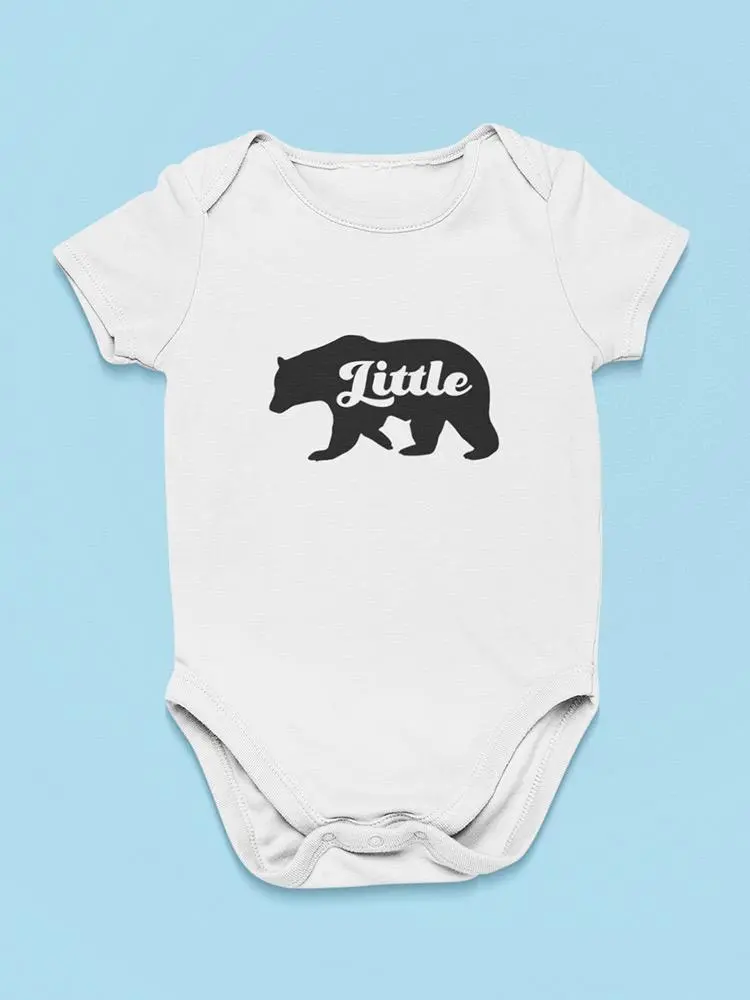 a white baby bodysuit with a bear on it