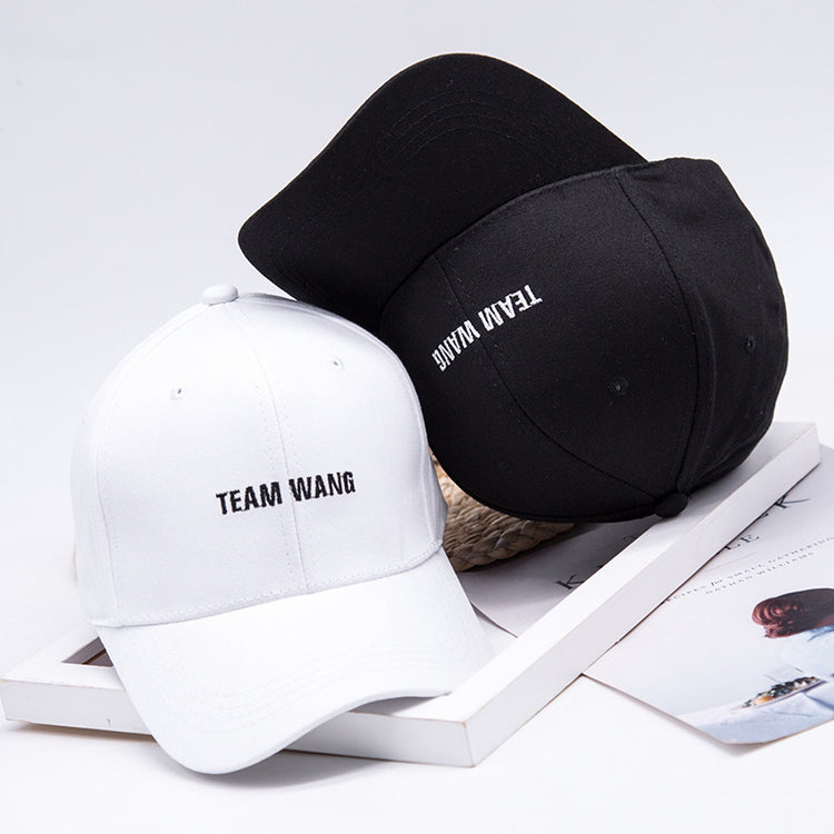a pair of hats on a white surface
