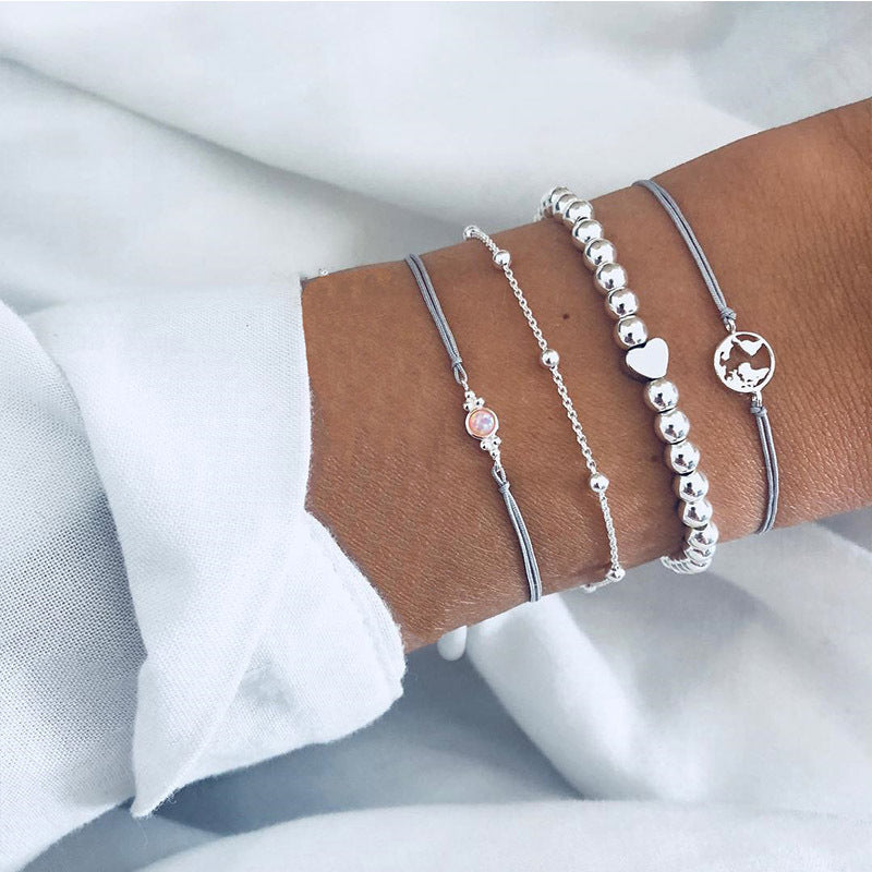 a person's wrist with bracelets