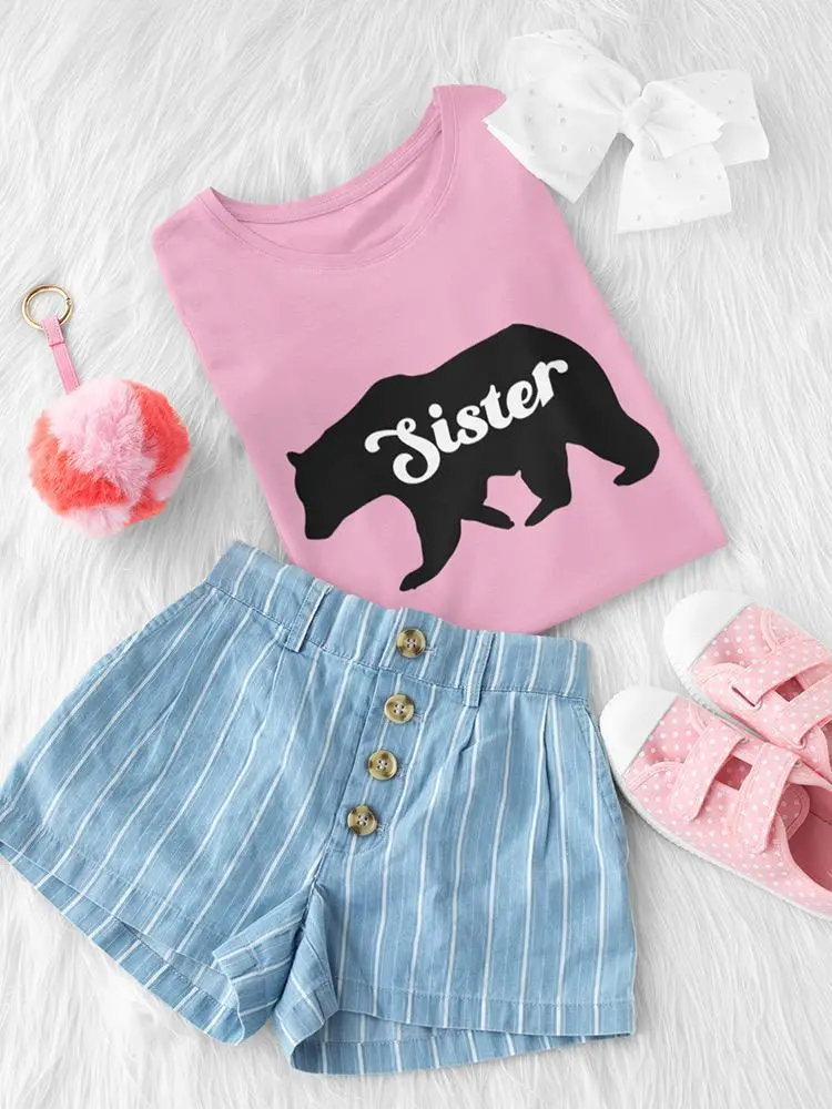 a pink shirt and shorts and shoes