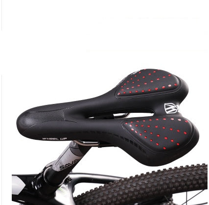 a black bicycle seat with red dots