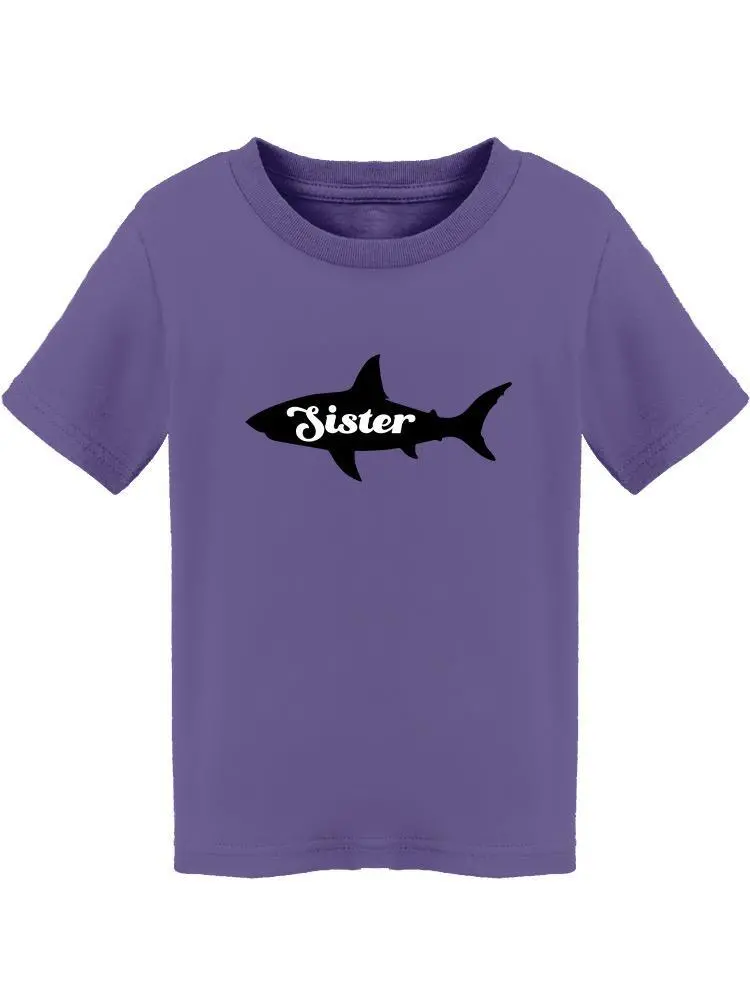 a purple shirt with a shark on it