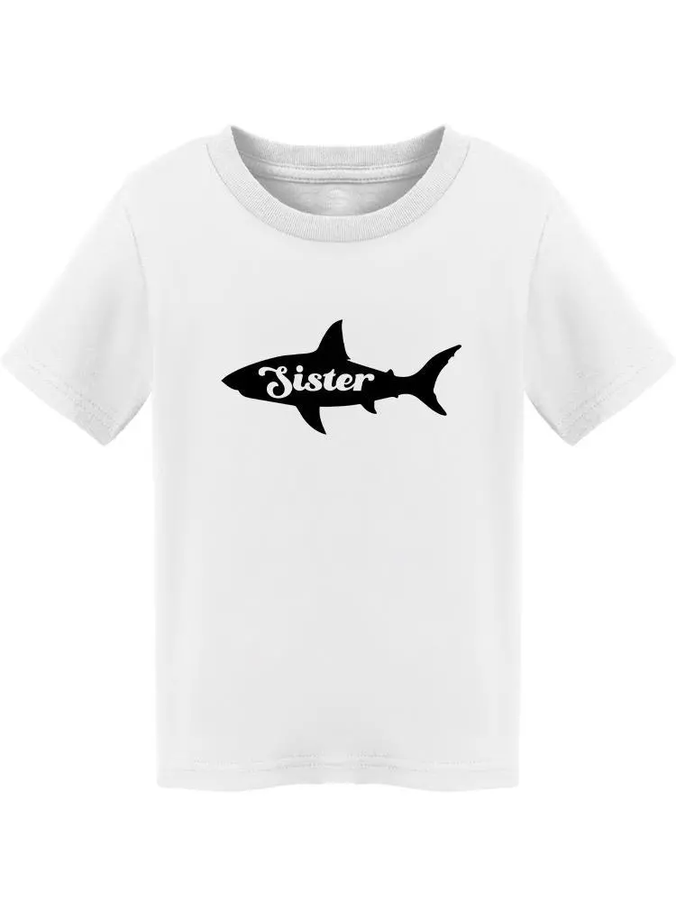 a white shirt with a shark on it