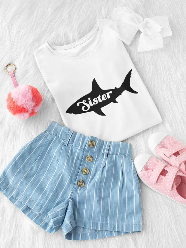 a shirt and shorts on a white fur surface