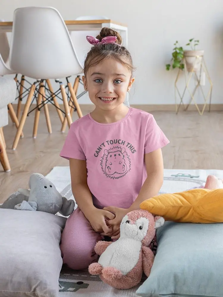 a girl sitting on a bed with stuffed animals