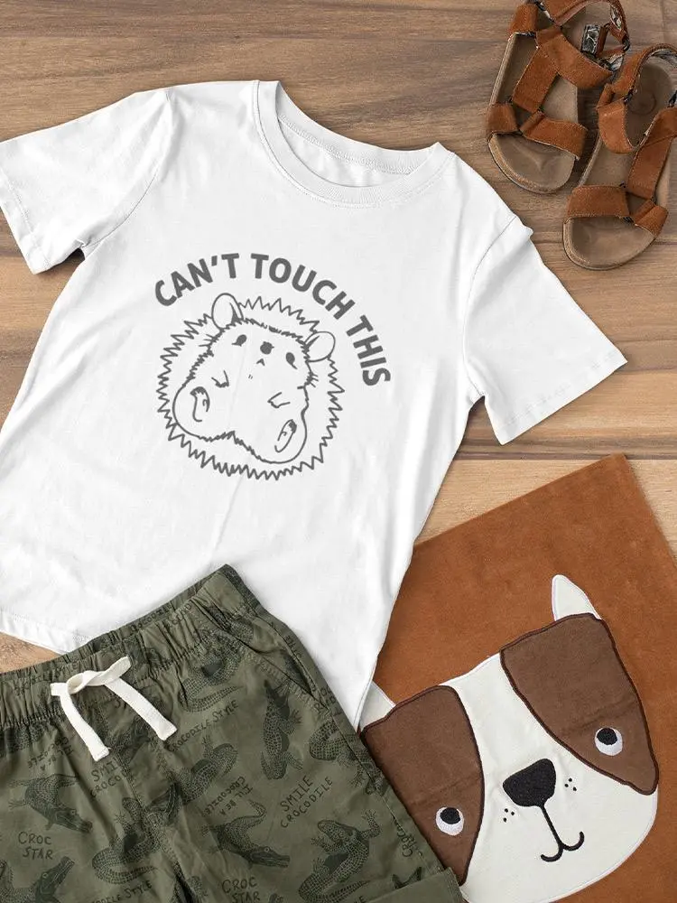 a white shirt and shorts on a wooden surface