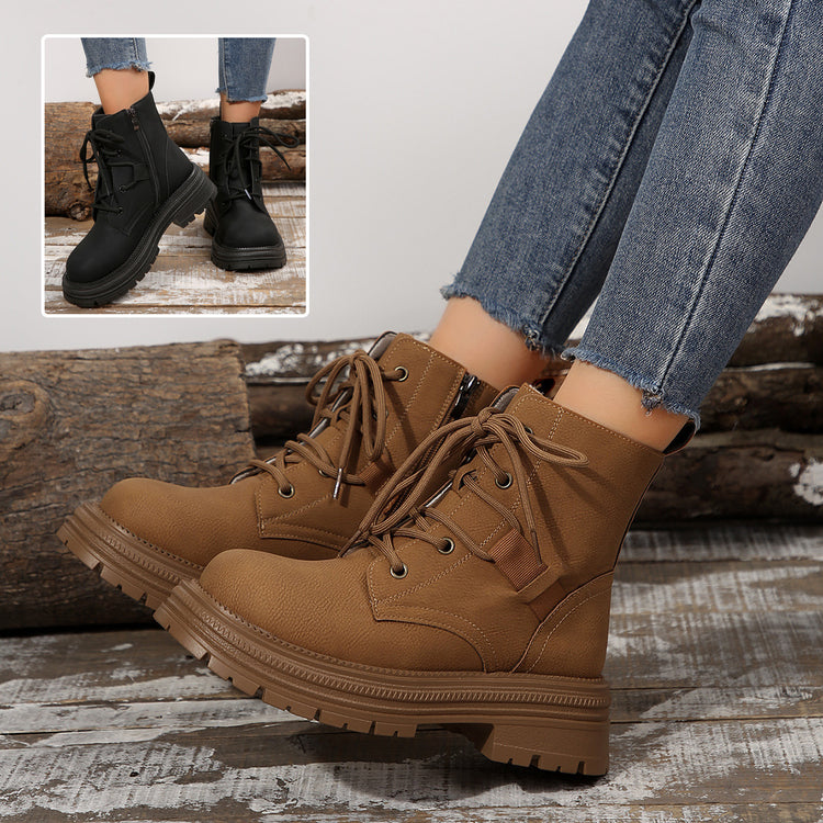 a person's legs wearing brown boots