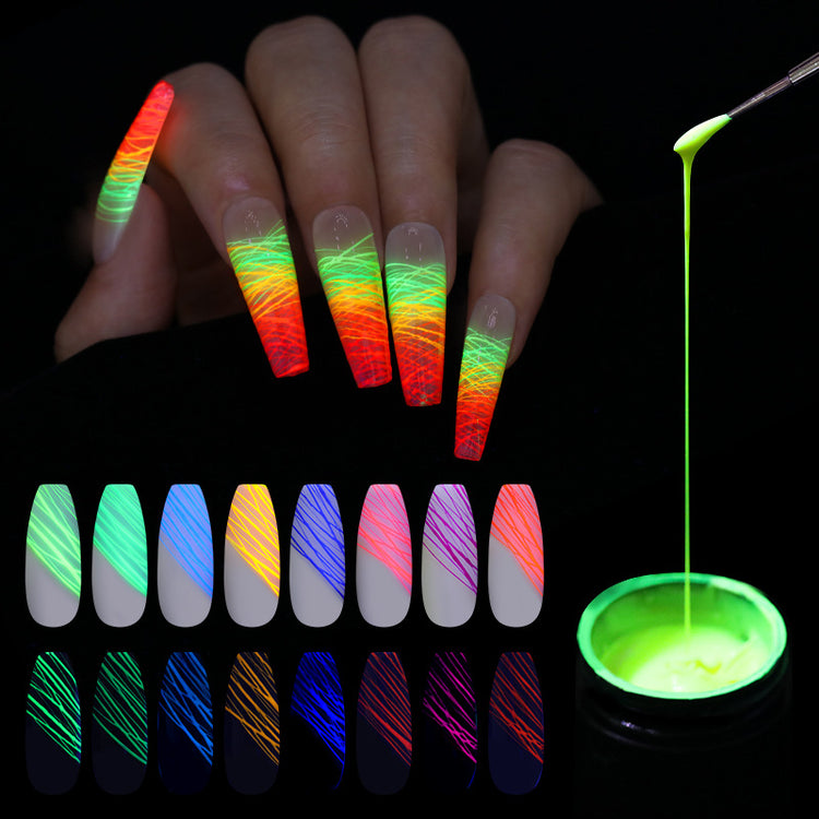 a hand with long nails painted with neon colors