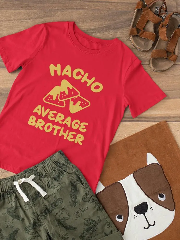 a red shirt and shorts on a wooden surface