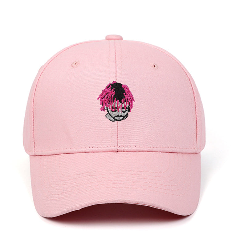 a pink hat with a cartoon face on it