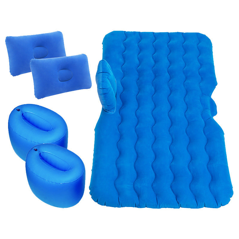 a blue air mattress and pillows
