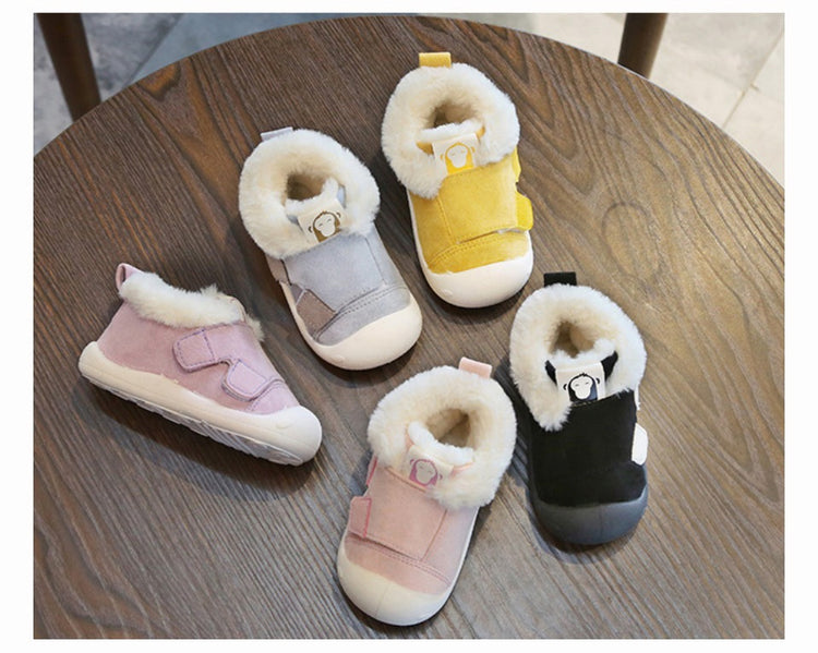 a group of baby shoes on a table