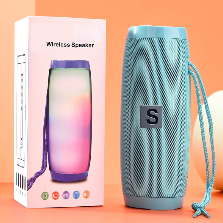 a blue speaker next to a box