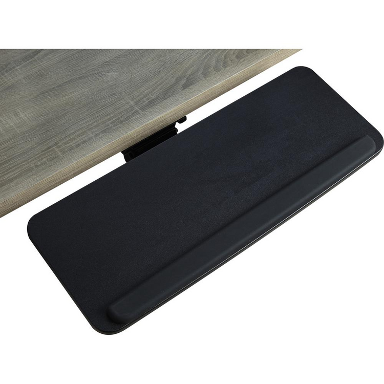 a black keyboard pad on a wooden surface