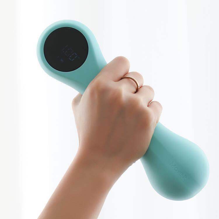 a hand holding a light blue device