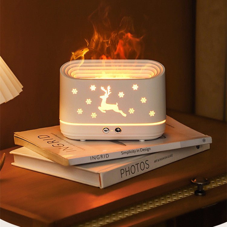 a white rectangular object with a deer design on top of a stack of books