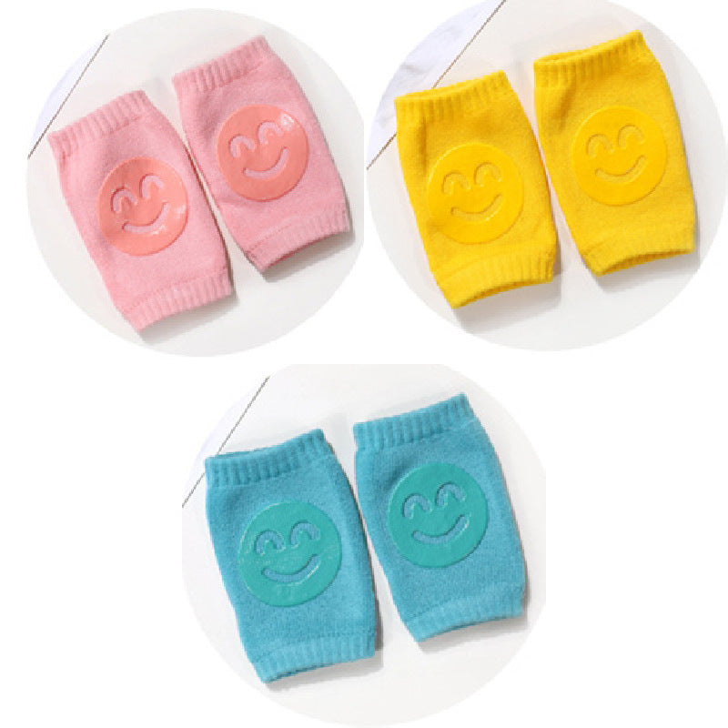 a group of baby socks with smiley faces